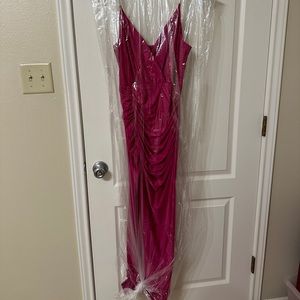 Long formal tight pink dress.